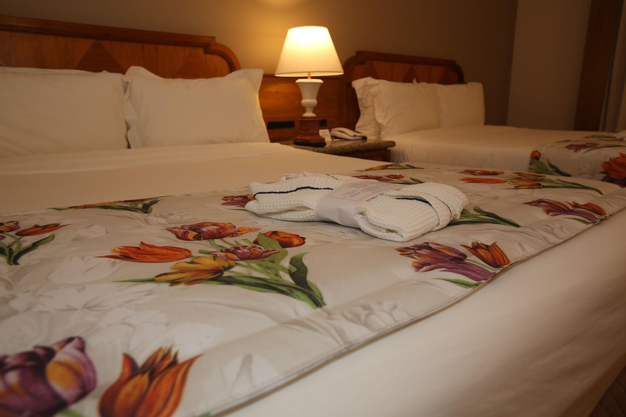 Mabu Thermas Grand Resort Foz do Iguacu Exterior photo A bed with a duvet